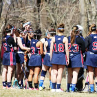 <p>Harvey School girls lacrosse coach Greg Janos talks with his team during a recent game. </p>