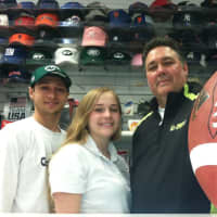<p>Pat Cecio, right, owner of All-Apparel Sports in Old Greenwich and his children William, 18, and Nicole, 16, stand in the store. Cecio says he only stocks Giants, Jets and Patriots jerseys and has no plans to add Manziel and Sam jerseys.</p>