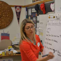 <p>Pace University&#x27;s Tiffany Zezula with a list from a group that she worked with.</p>