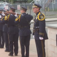 <p>The Norwalk Police Honor Guard fires off a salute to honor the officers who have died in the line of duty.</p>