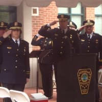<p>Norwalk Police Department leaders and officers salute the four Norwalk officers who have died in the line of duty.</p>