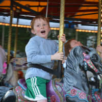 <p>6-year-old Patrick Calabro, a Darien, Conn., resident, on a carousel at the carnival.</p>