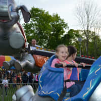 <p>Three-year-old Caroline Labov, Pound Ridge, on a ride at St. Patrick&#x27;s carnival in Bedford.</p>