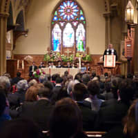 <p>The Rev. Jeffrey Rider of Green&#x27;s Farms Church speaks to hundreds of mourners gathered at Christ &amp; Holy Trinity Church in Westport on Tuesday to celebrate the life of Bradley Helt, who died April 9 at 16. </p>
