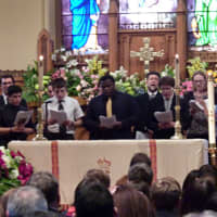 <p>The Fairfield Prep Choir sings during Westport teen Bradley Helt&#x27;s funeral service Tuesday. </p>