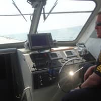 <p>Sgt. Peter LaPak of the Norwalk Police Marine Unit patrols Norwalk Harbor.</p>
