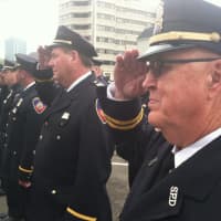 <p>Stamford Police Capt. Bill Mullin, at right, and Capt. Brian McElligott, beside Mullin, salute during an annual memorial service for Stamford Police Officers who died while on duty.</p>