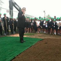 <p>The Rev. Frank Winn, pastor of St. Paul&#x27;s Church, blesses the groundbreaking of the new athletic center at Convent of the Sacred Heart School. The school renamed its main building Salisbury Hall in honor of Nancy Salisbury.</p>