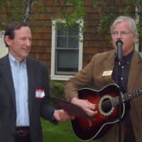 <p>Chamber members Dick Kelsey, left, and John Lundeen sing a song for Carol Wilder-Tamme.</p>