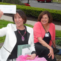 <p>Carol Wilder-Tamme displays a gift certificate.</p>