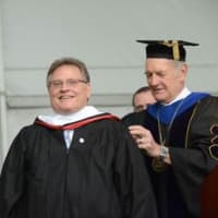 <p>Manhattanville College Jon Strauss, right, awards commencement speaker and Manhattanville alumnus John Shaw, with an honorary degree.

 </p>