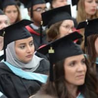<p>Manhattanville College graduate students listen during the ceremony.</p>