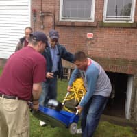 <p>Volunteers from Norwalk&#x27;s Knights of Columbus help to clean out the basement of the Notre Dame Convalescent Home recently.</p>