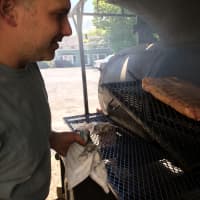 <p>Gino Marsili, owner of the Wire Mill BBQ restaurant in Redding, smokes the bacon he serves on one of the two reverse flow wood smokers that are behind the restaurant.</p>