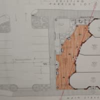 <p>A photo of the site plan for the proposed new building.</p>