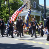 <p>American military veterans march down Main Street during last year&#x27;s Memorial Day parade in Ridgefield. </p>