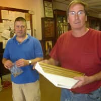 <p>Don Wemer, Sr.  right, with material he used to build the new sign for Protection Co. No, 1 in Hastings</p>
