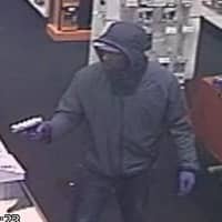 <p>One suspect displayed a silver handgun in the robbery of a Radio Shack at 247 N. Central Park Ave. in Hartsdale.</p>
