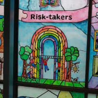 <p>One of the stained-glass panels depicting the educational attribute &quot;Risk-takers&quot;.</p>