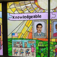 <p>Being &quot;Knowledgeable&quot; is a trait that Jackson School students featured in their stained glass art.</p>