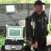 <p>Norwalk Police Department Officer John Haggerty talks about the new Mobile Data Terminal, a laptop, pictured, on the NPD&#x27;s Harley Davidson motorcycle. He said the unit along with the E-printer (not pictured) will cut the time of traffic stops.</p>