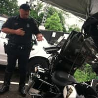 <p>Norwalk Police Department Officer John Haggerty talks about the new Mobile Data Terminal, pictured, on the NPD&#x27;s Harley Davidson motorcycle. He said the unit along with the E-printer (not pictured) will cut the time of traffic stops.</p>