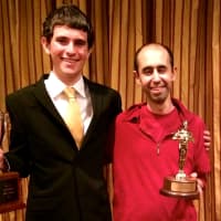 <p>Danny DeBois holding the championship from the National Catholic Forensic League tournament. </p>