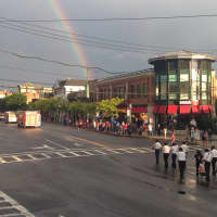<p>A rainbow casts over Mamaroneck Avenue during the Village of Mamaroneck Memorial Day Parade Friday. </p>