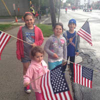 <p>(From L to R) Evelyn, 10, Charlotte, 3, and Clare Picone, 8, and Sean Mohr, 7 watch the parade. </p>