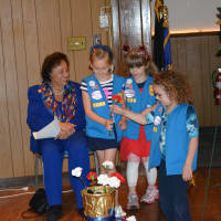 <p>Girl Scouts come up with a flower for Mount Kisco&#x27;s Memorial Day service.</p>