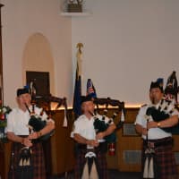 <p>Members of the Mount Kisco Scottish Pipes and Drums give a Memorial Day service performance.</p>