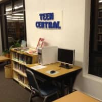 <p>The unappealing Teen Central is comprised of a desk and bookshelf along the wall, which the foundation attributes its young adult programs drawing 26 percent of the state average in 2010. </p>