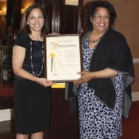 <p>Shirley Acevedo Buontempo, founder and executive director of Latino U College Access, and Iris T. Pagan, executive director, Westchester County Youth Bureau, display a Westchester County proclamation. </p>