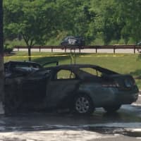 <p>The scene after the fire was extinguished at the chain reaction crash at the Mobil station in Harrison on Tuesday.</p>