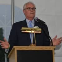<p>Bill Harrington makes acceptance remarks from the podium.</p>