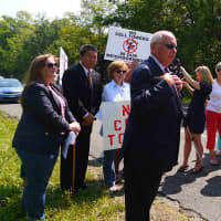 <p>Westport First Selectman Jim Marpe speaks to those gathered at the side of Greens Farms Road on Tuesday to protest the proposed cellphone tower. </p>