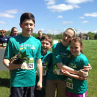 <p>Spencer Lovely, William Lovely, Caitlyn Lovely and Katie Nedder celebrate after the race. </p>