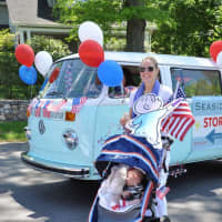 <p>Denise Corcoran and daughter Phoebe march in the Memorial Day parade with Harold and his Purple Crayon.</p>