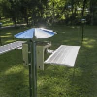 <p>Smallwood&#x27;s Coronium 3500 (Lucie&#x27;s Halo) is a field of twelve solar-powered sound-making devices set up in Caramoor&#x27;s picnic grounds.</p>