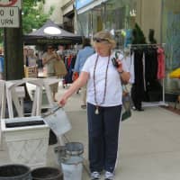 <p>Marsha Givens looked through some housewares in Bronxville before moving on to the next sale.</p>
