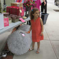 <p>Gracie got a kick out of the &quot;spiky ball&quot; at the Bronxville Sidewalk Sale.</p>