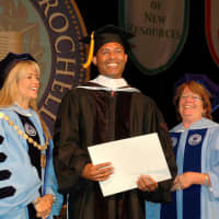 <p>Mariano Rivera, center, is presented with an honorary degree from the College of New Rochelle.</p>
