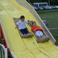 <p>6-year-old Sam Zdanoff (left) and 7-year-old Octavio Esposito (right) on a slide at the Fol de Rol.</p>