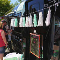<p>People line up for coffee at the Buzz Truck, a new venture from Fairfield residents Jessica and Alex Grutkowski. </p>