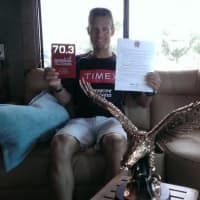 <p>Easton&#x27;s Chris Thomas relaxes after winning the 70.3-mile Eagleman triathlon Sunday in Cambridge, Md. </p>