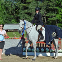 <p>White Plains resident Patricia Griffith, &quot;Platinum&quot; the horse, and Platinum&#x27;s owner Lexi Maounis pose with their title after the weekend&#x27;s win.</p>