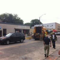 <p>First responders gather at the scene of two underground explosions in Norwalk on Tuesday morning. </p>