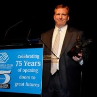 <p>Chris Scatterday, assistant general manager of Lexus of Mt. Kisco, accepts the John Beach Award on behalf of the Lexus of Mt. Kisco team. </p>