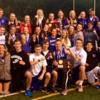<p>Members of Darien&#x27;s boys and girls track teams celebrate after both squads won State Open championships Monday in Middletown.</p>