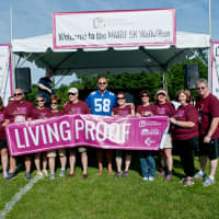 <p>Kathy Giusti with patients living with myeloma and Mark Herzlich.</p>